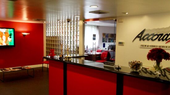 The Accord production company offices with a reception desk, waiting area and an office behind.