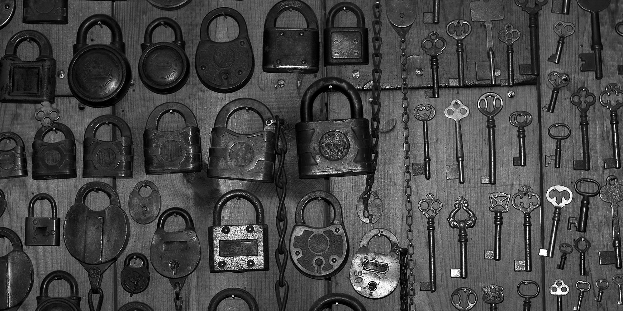 A whole bunch of old fashioned locks and keys.
