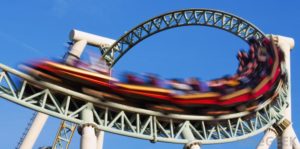A roller coaster going through a loop.