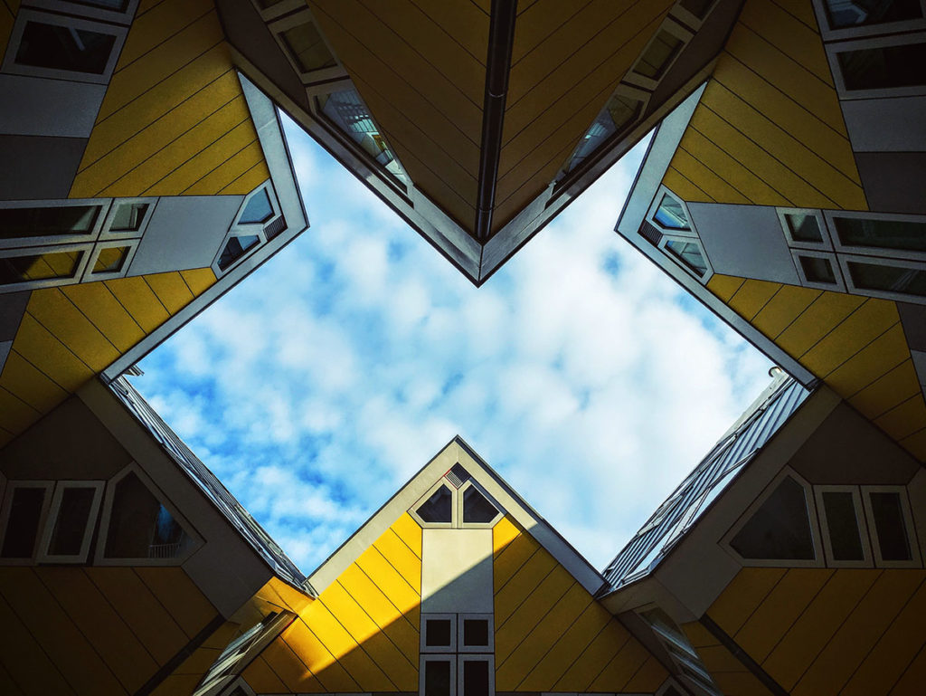 Yellow houses with a blue sky above them.