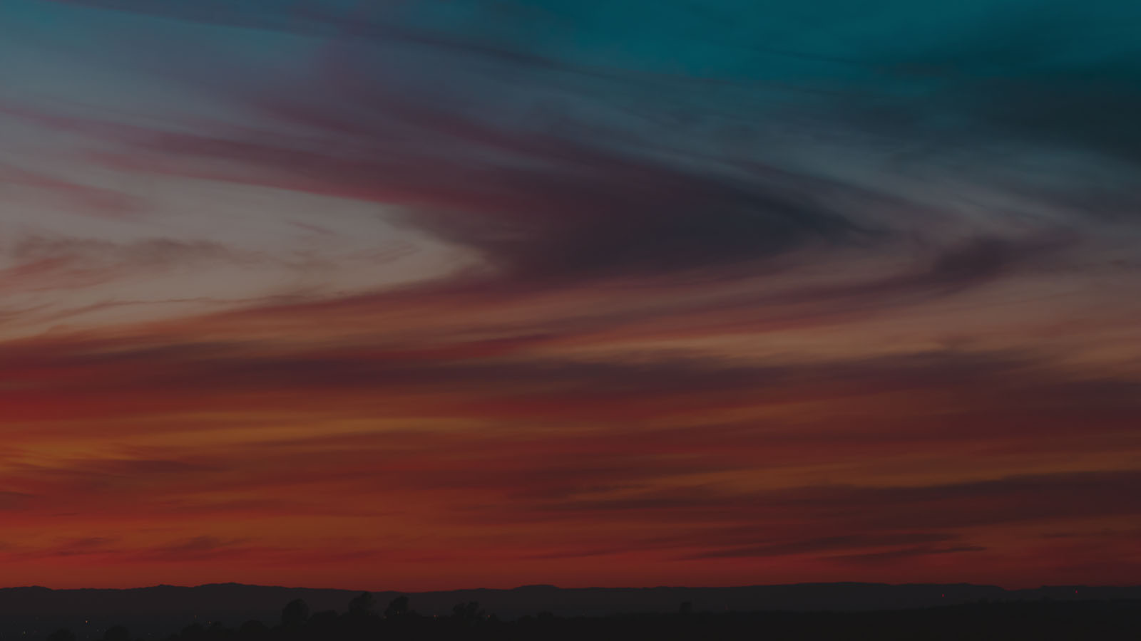 A beautiful twilight sky with reds, oranges, purples and blues.