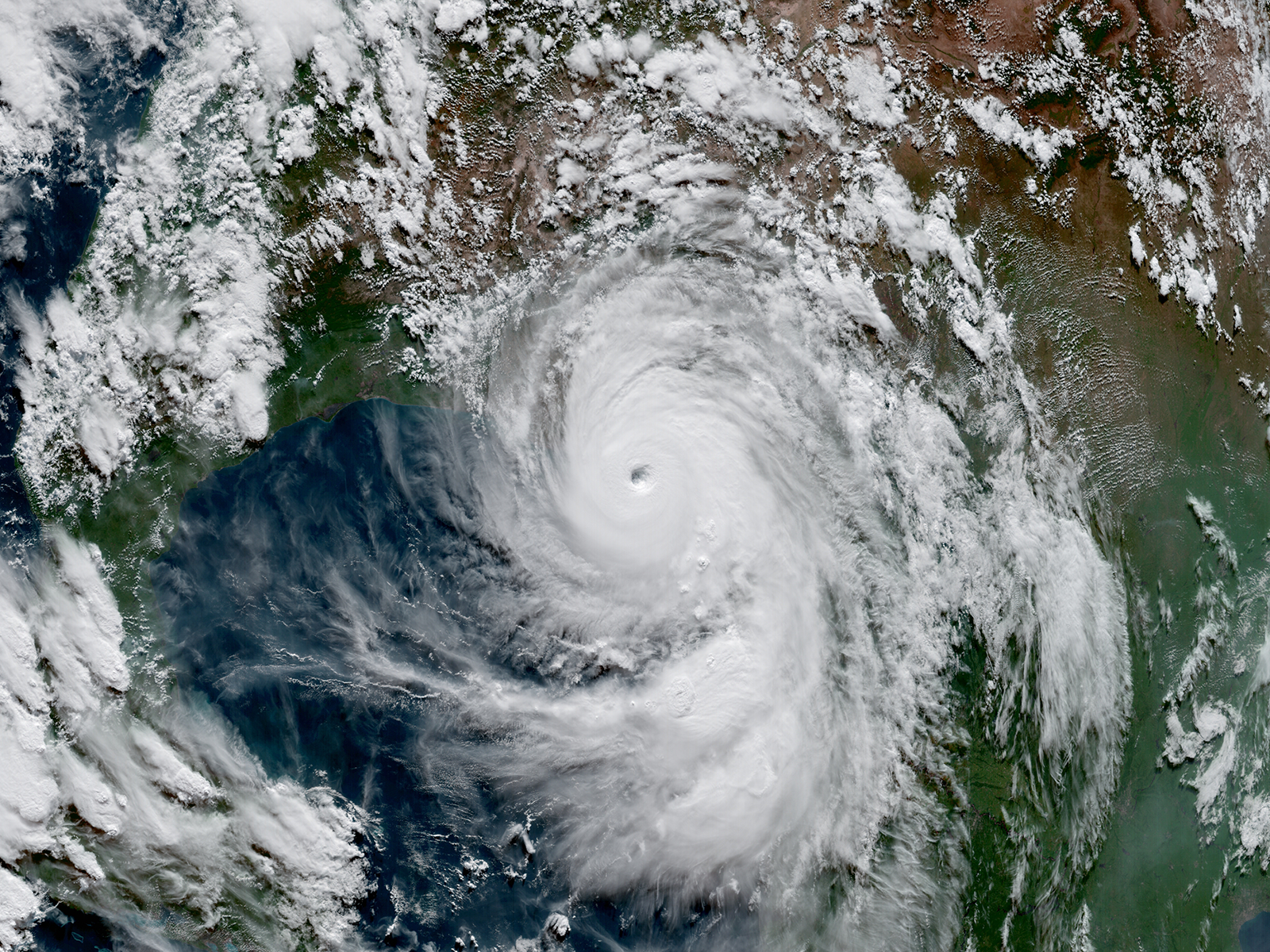 A hurricane making landfall, as seen from space.