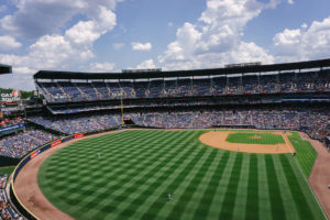 A baseball field in a large stadium.