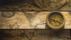 An old timey map with an old compass on it.