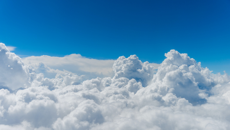 White, puffy clouds in a blue sky.