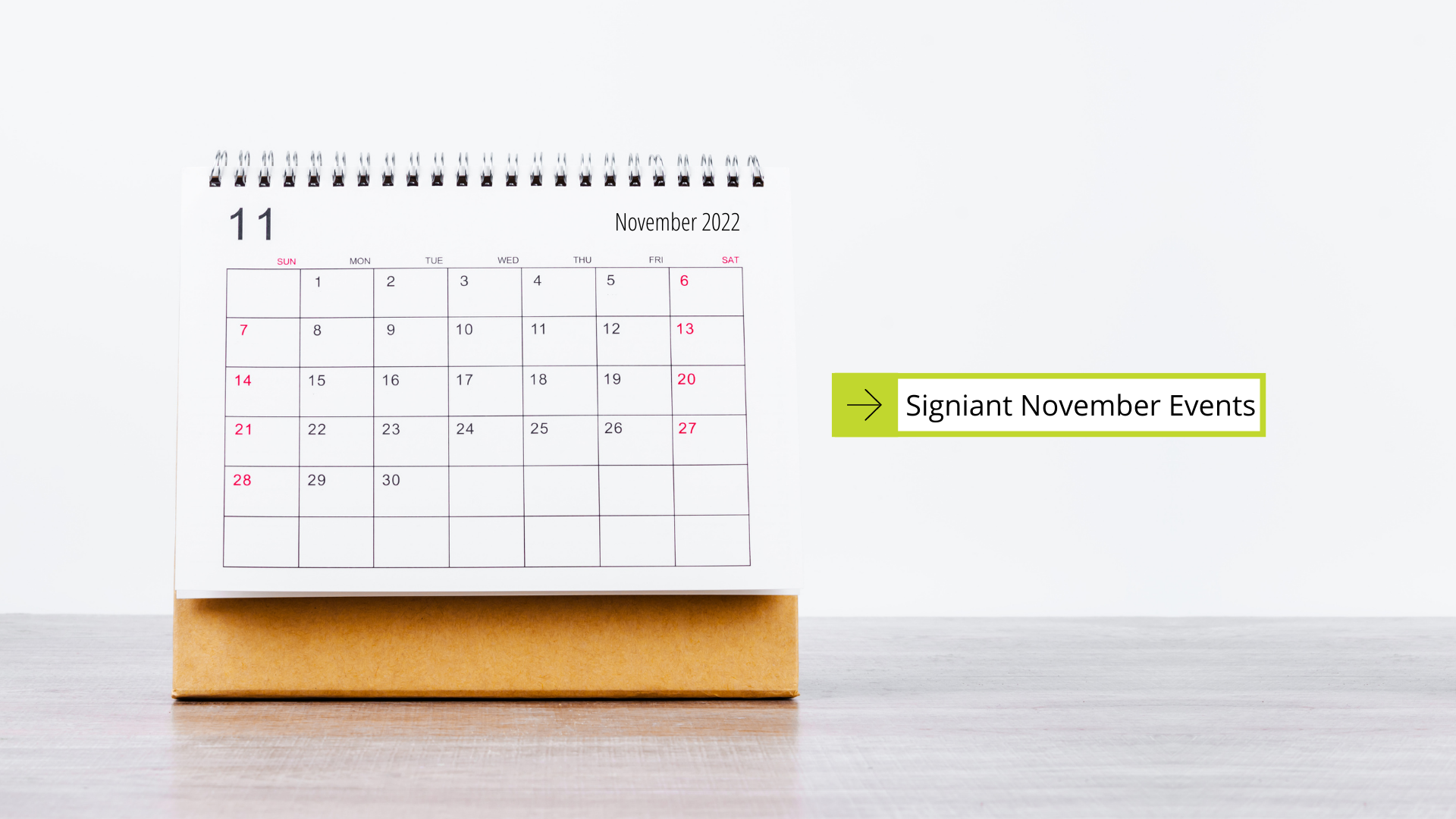 Signiant November Events calendar propped up on table with white background