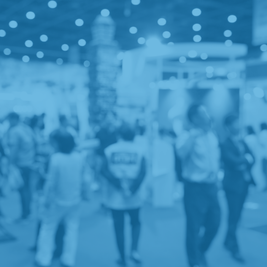 Blue blurred out picture of people at an event