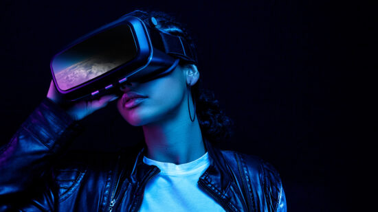 Person wearing Virtual Reality headset with black background